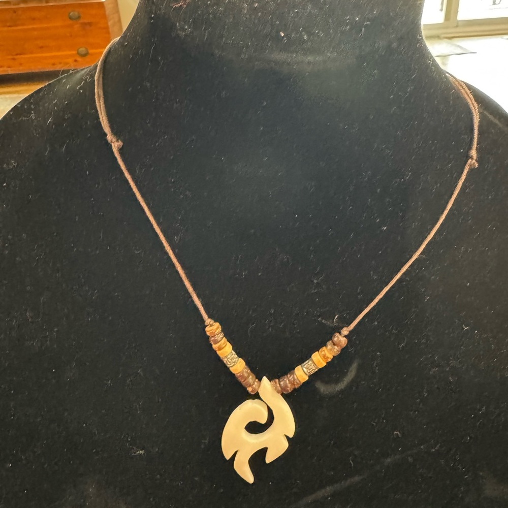 Handcrafted Brown Cord Necklace with Carved Cream Pendant